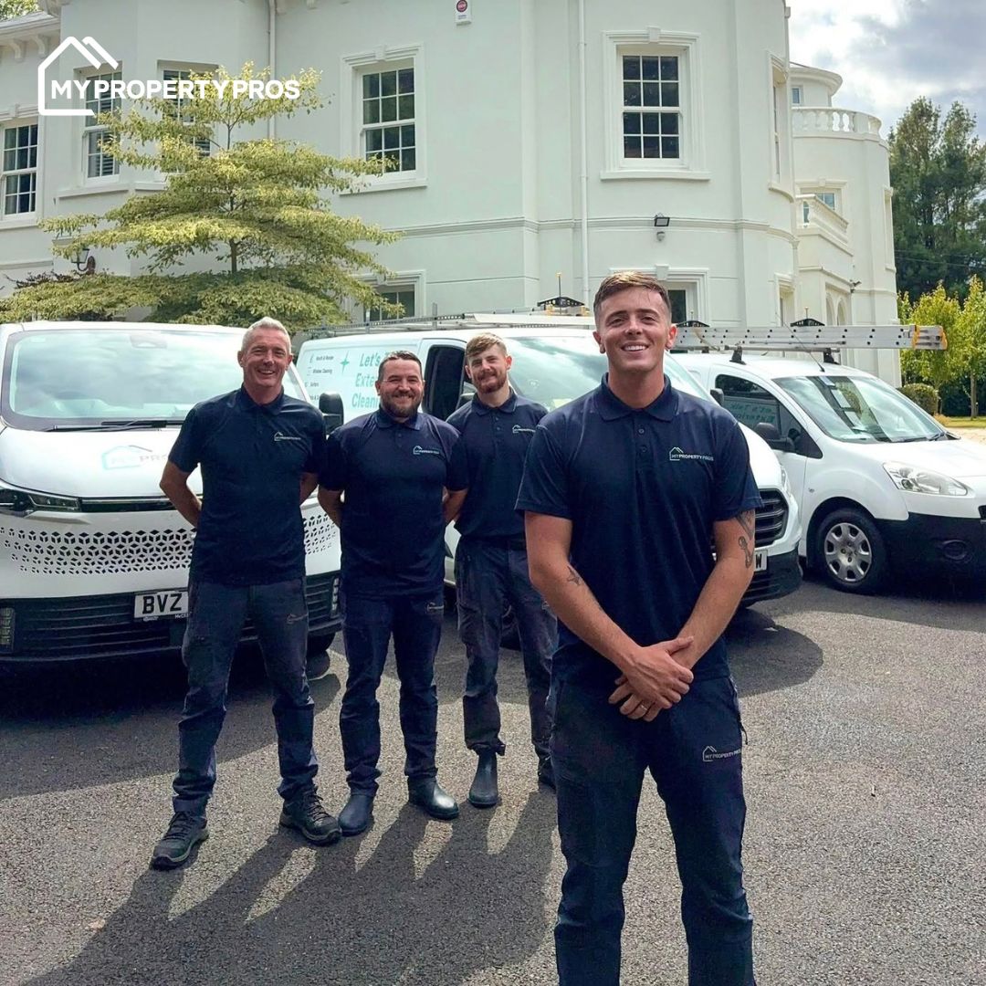 Aidan Davis and his team standing in front of their My Property Pros vans