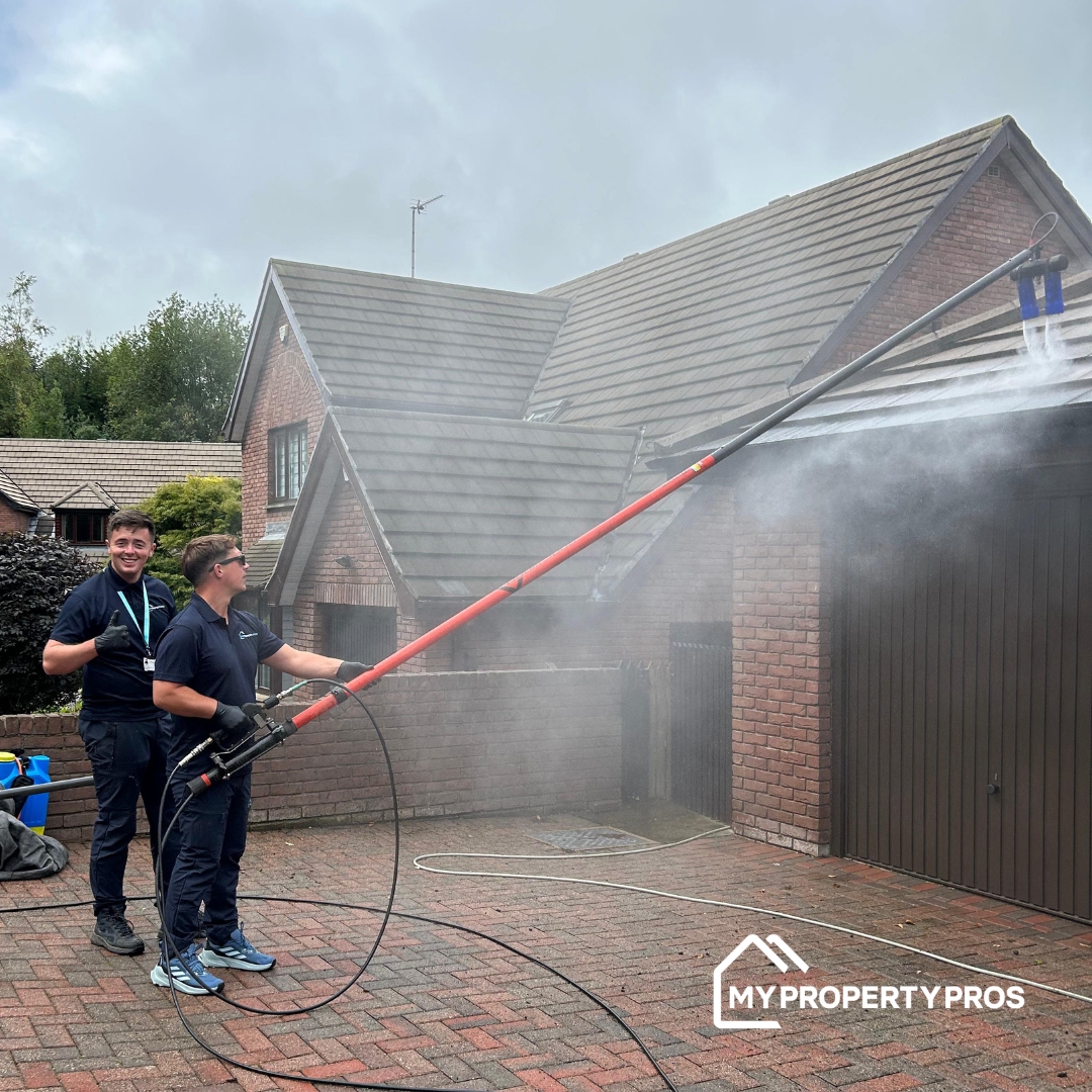 Aidan Davis training Stuart Smart on the Roof Wand water-fed pole system on a roof in Northern Ireland