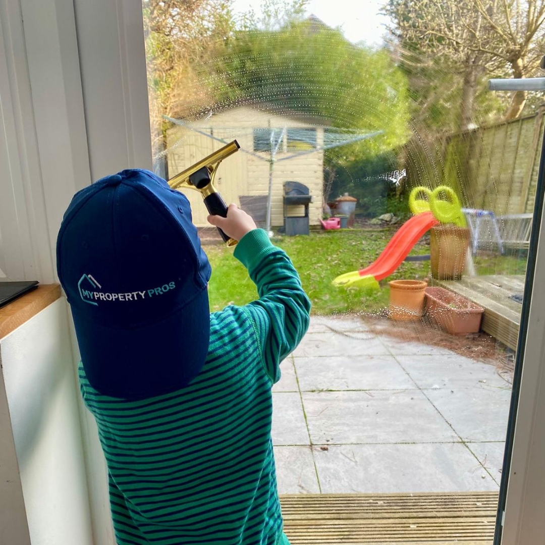 Stuart Smart's son cleaning a window